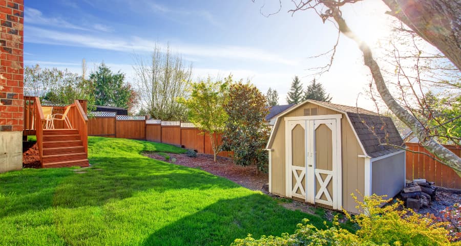 Fenced backyard with storage shed in Orlando